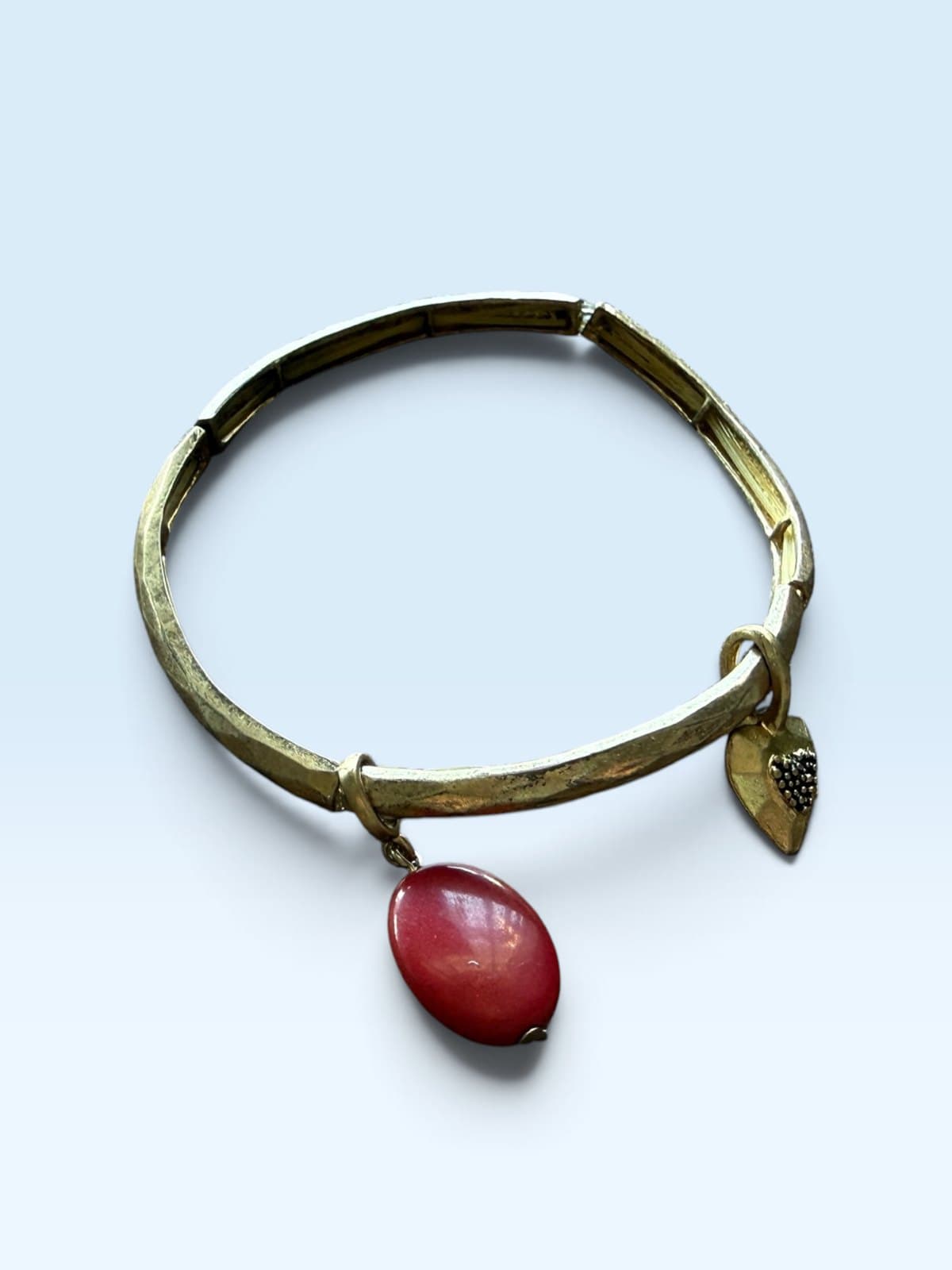 Textured Gold Tone Bracelet with Red Stone Charm
