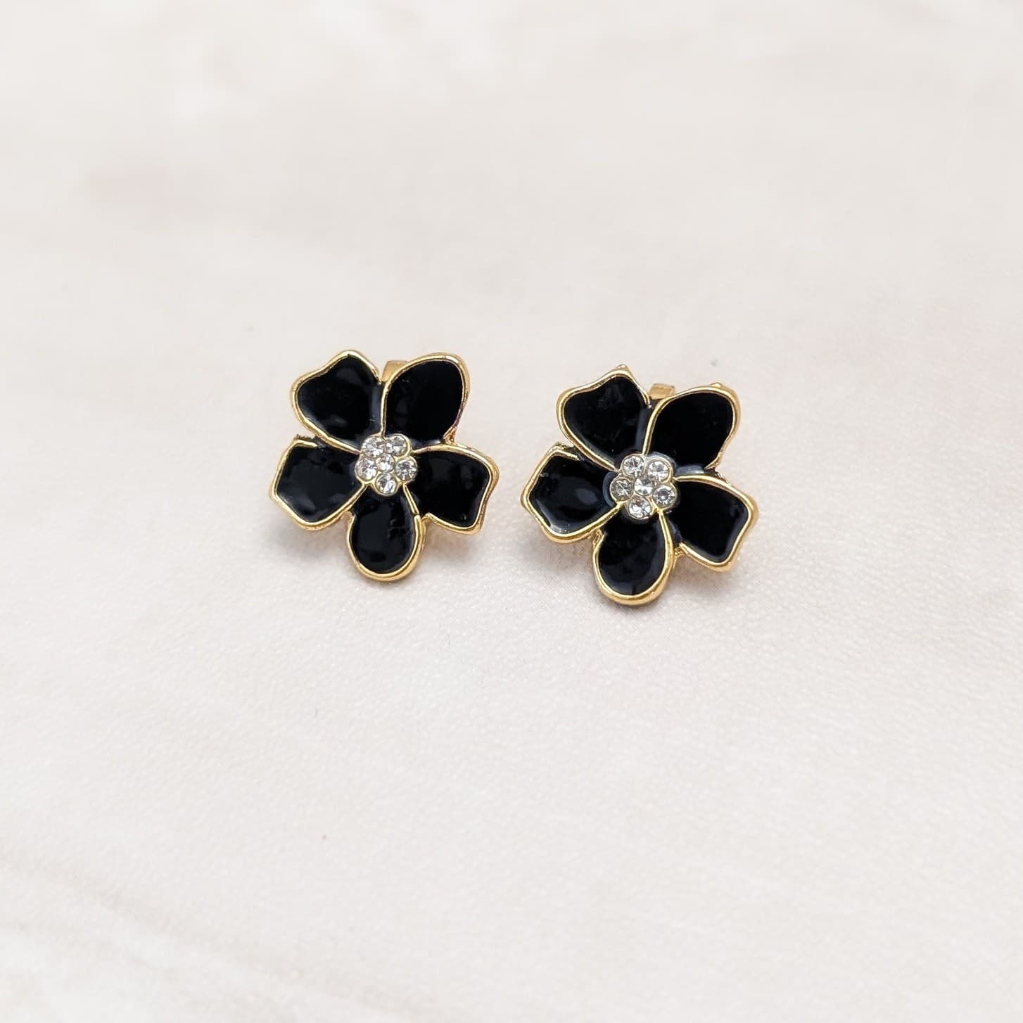 Black Enamel Small Flower Small with Clear Gem Accents Clip On Earrings