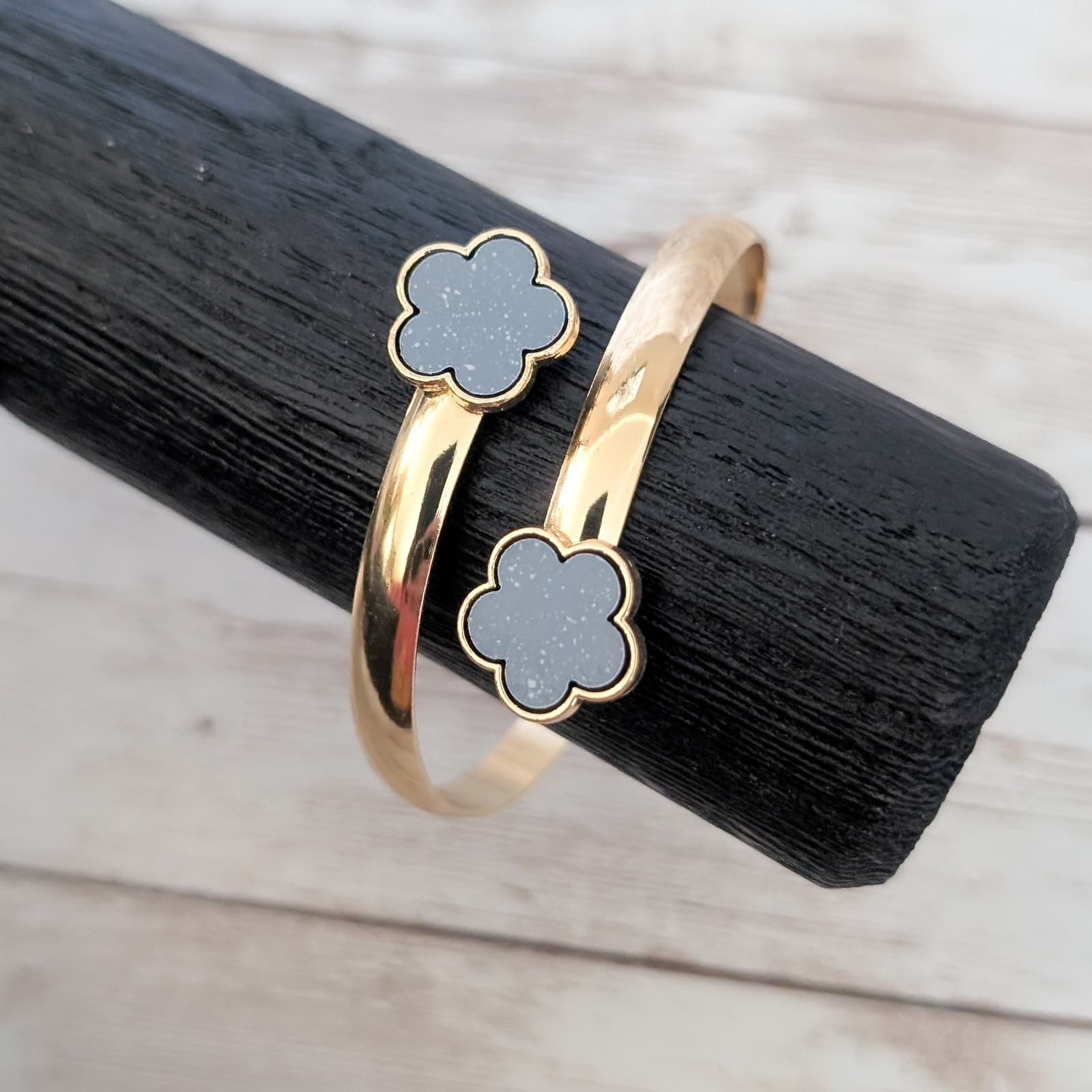 Gold Tone Bracelet with Black Flower Detail