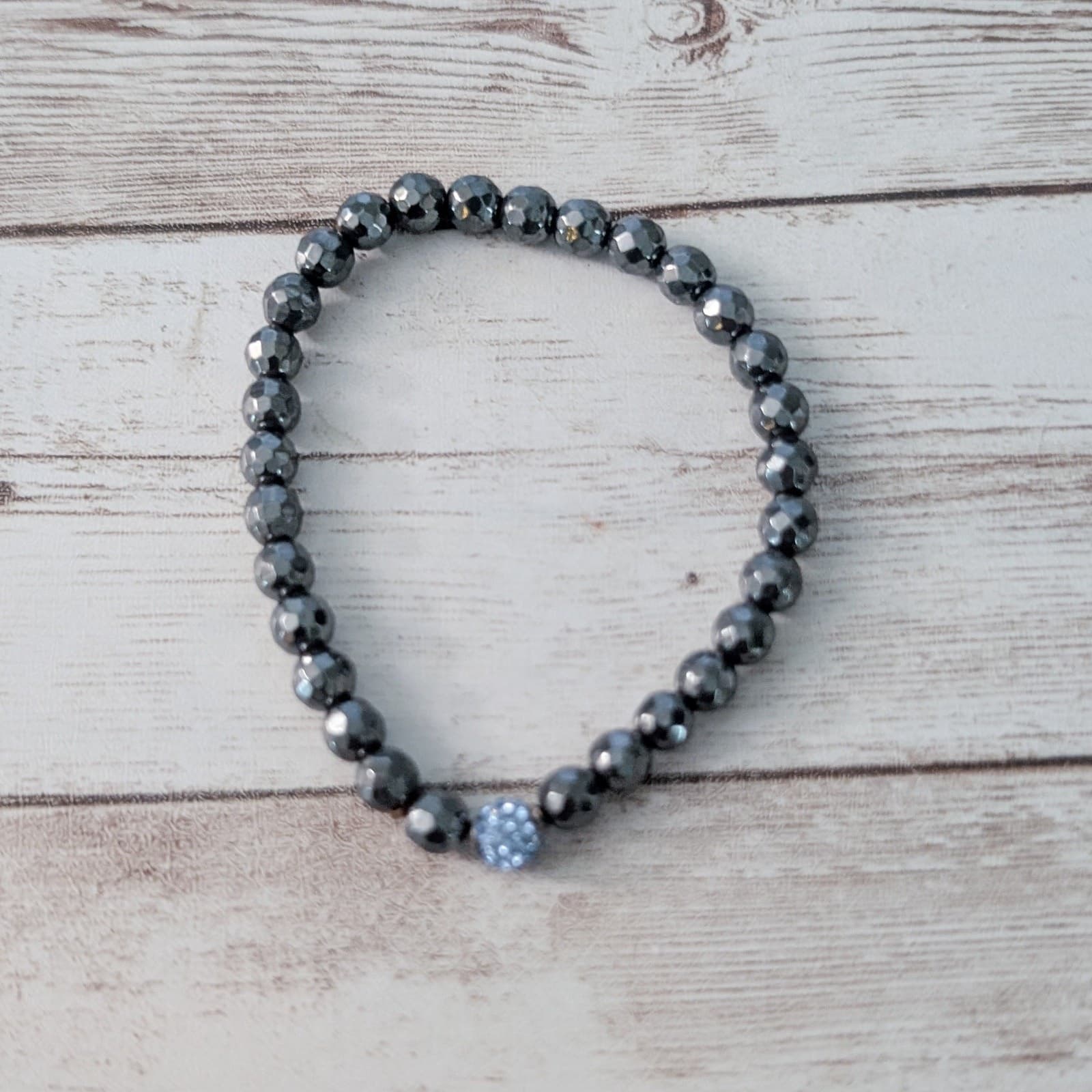 Dark Grey Stretch Bracelet with One Bead with Blue Gems
